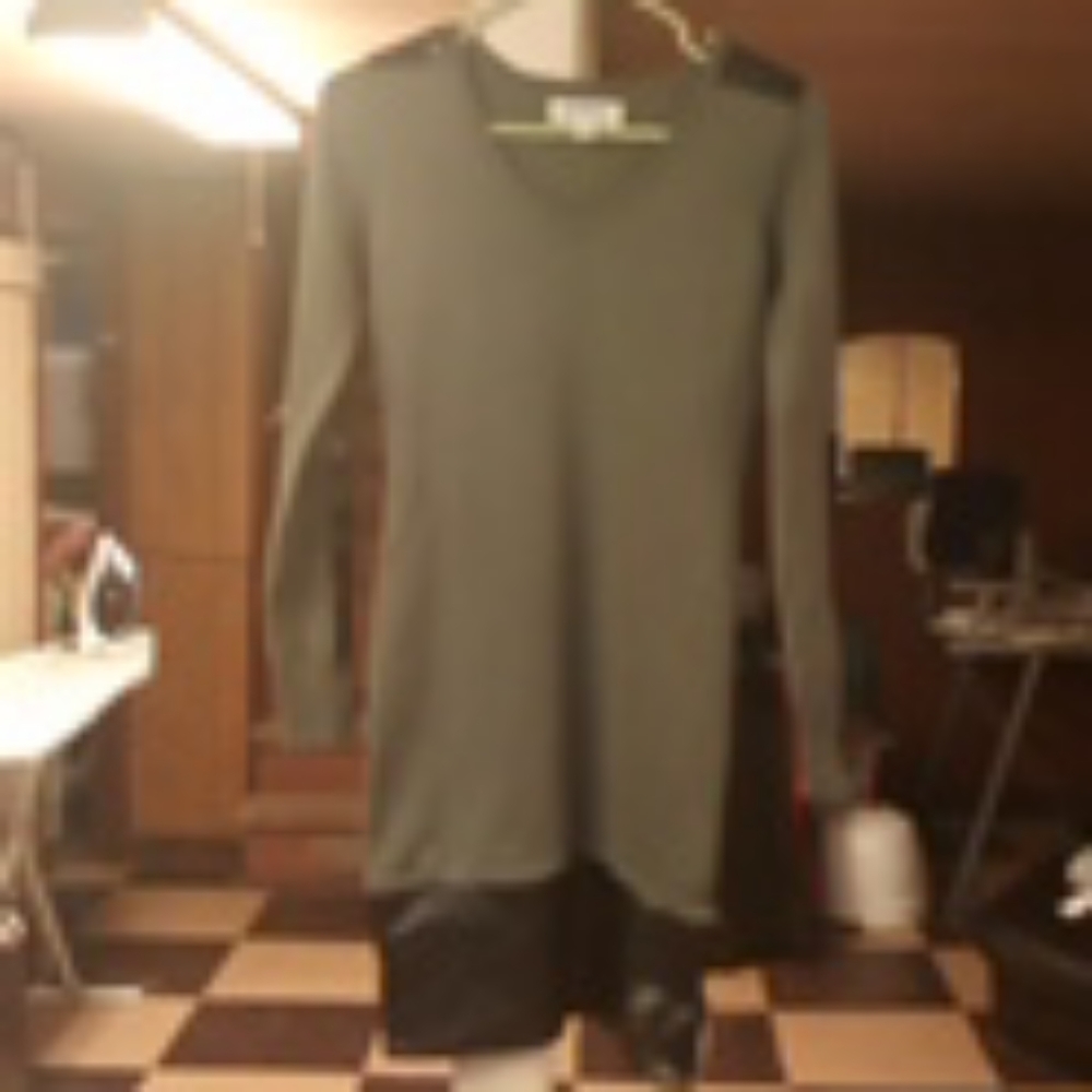 Green fitted dress with faux leather trimming